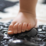 
  
  Childs Foot being stimulated by a Muffik Sensory Play Mat
  
